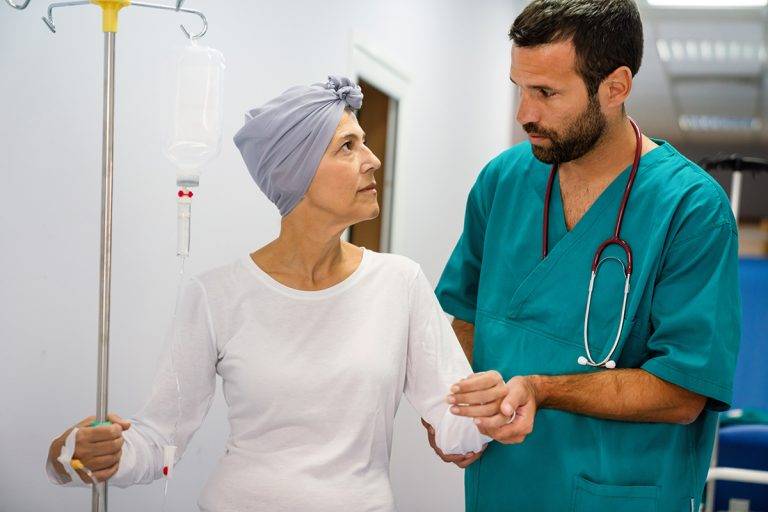 Woman with cancer during chemotherapy recovering from illness in hospital