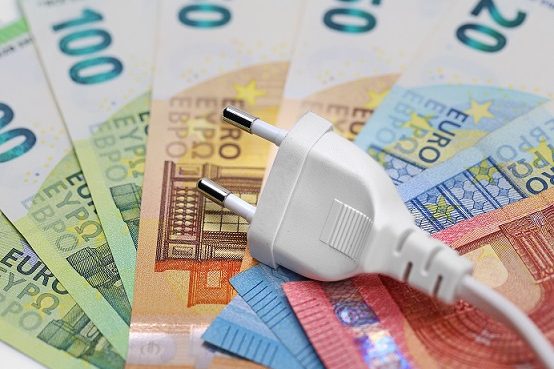 white plug on euro banknotes, concept of electricity price increase