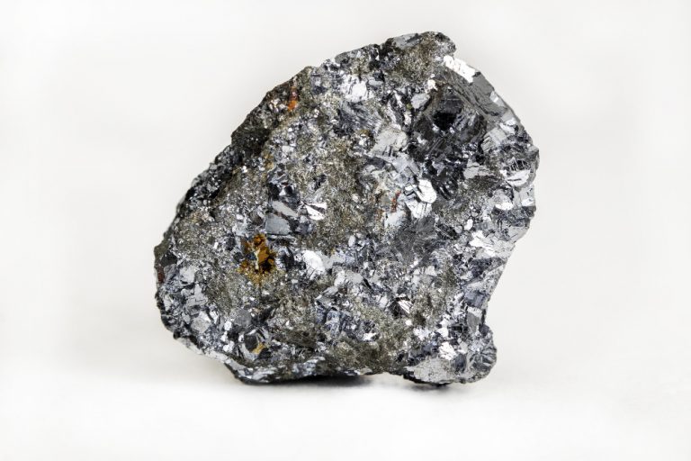 closeup-of-a-colourful-mineral-stone-under-the-lights-isolated-on-a-white-background