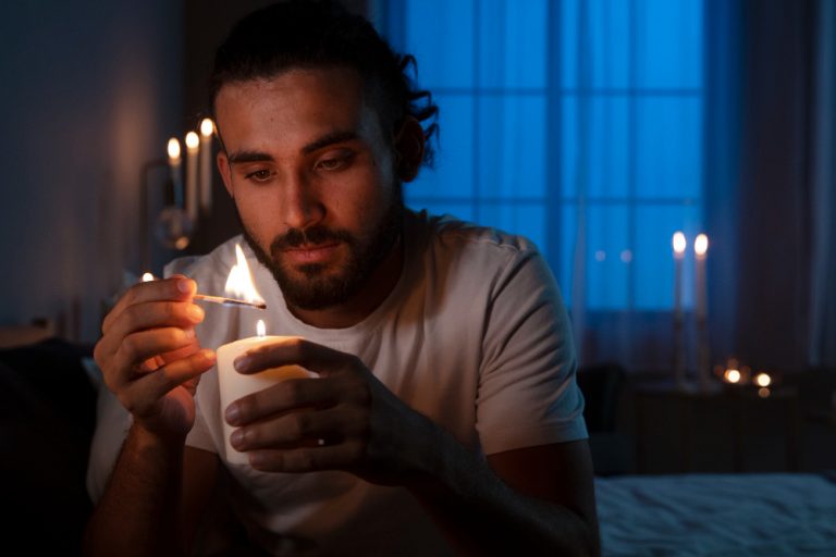 front-view-man-lighting-candle