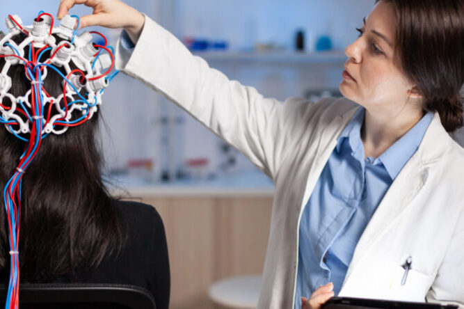 Back view of woman patient wearing performant eeg headset