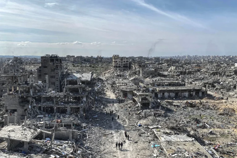 displaced-palestinians-start-to-return-their-houses-past-damaged-houses-in-jabalia-and-beit-lahia-regions-passing-through-al-saftawi-street-in-the-north-of-gaza